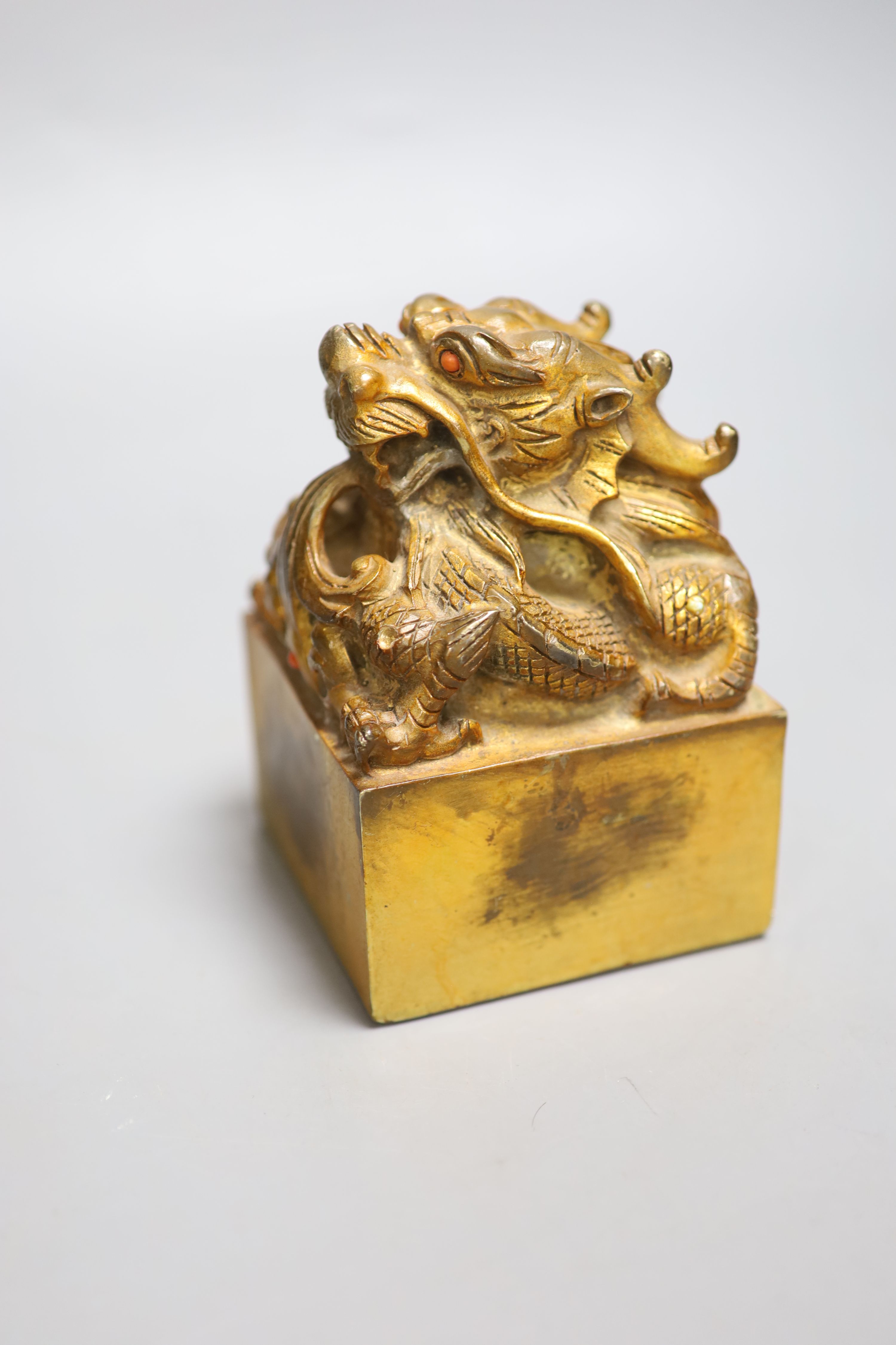 A Chinese gilt bronze dragon seal, height 13cm